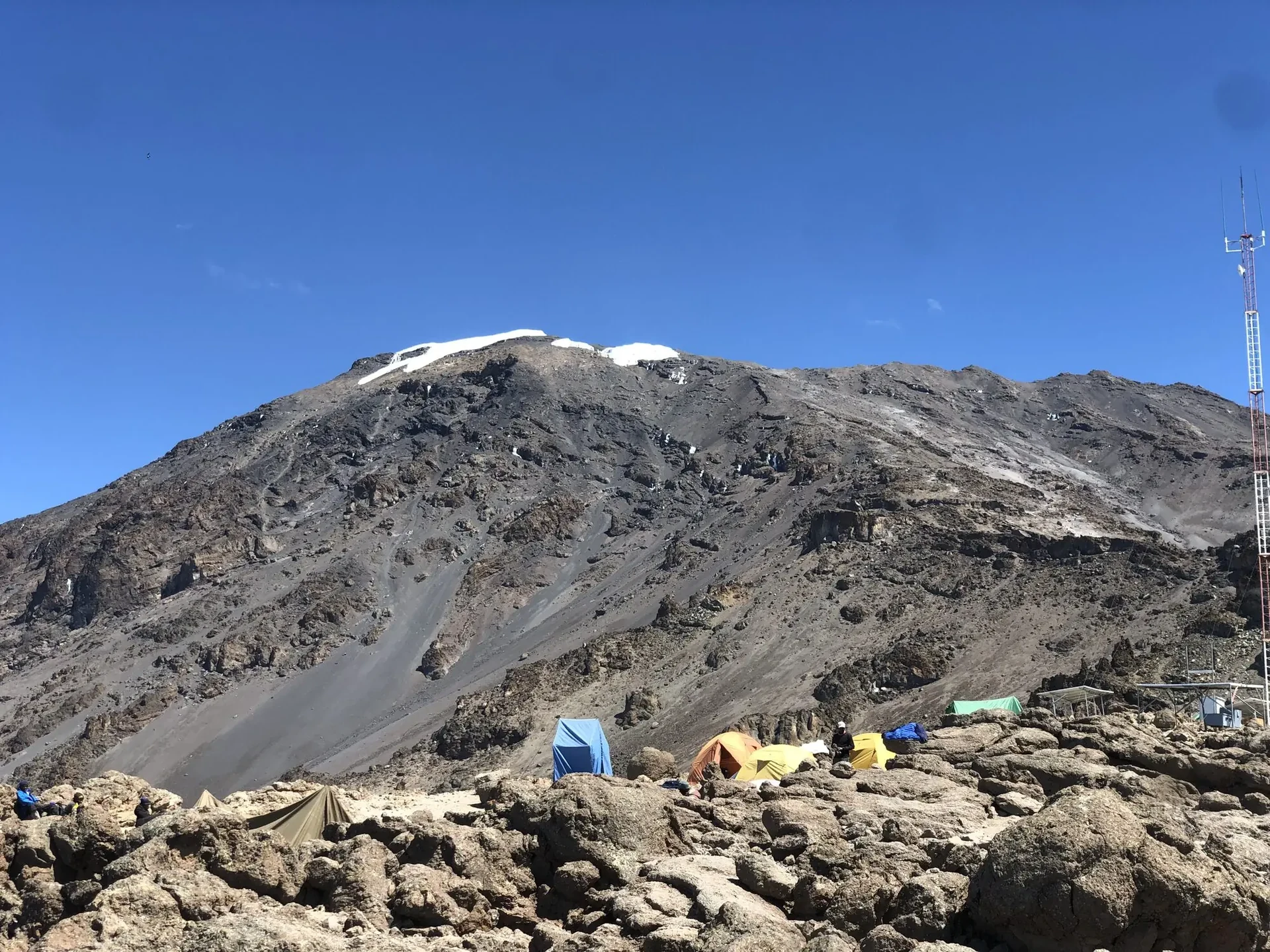 Trekkers on the Uhuru summit ridge of Kilimanjaro at sunrise